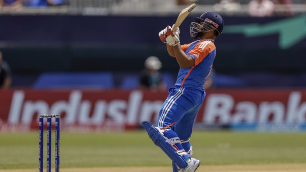 India's Rishabh Pant plays a reverse shot for six runs to seal the victory by 8 wickets against Ireland during an ICC Men's T20 World Cup cricket match at the Nassau County International Cricket Stadium in Westbury, New York