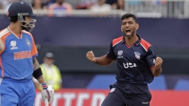 United States' Saurabh Netralvakar, right, celebrates the dismissal of India's Virat Kohli, left, during the ICC Men's T20 World Cup cricket match between United States and India at the Nassau County International Cricket Stadium in Westbury, New York. (AP)