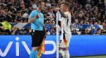 Germany's Toni Kroos speaks with assistant referee Benjamin Pages during a VAR referral after Germany's Ilkay Gundogan was fouled by Scotland's Ryan Porteous