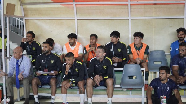 India coach Trishan Patel (second from left) and manager Stephen Constantine are on the team's bench during a FIFA qualifier against Saudi Arabia in Islamabad last week.