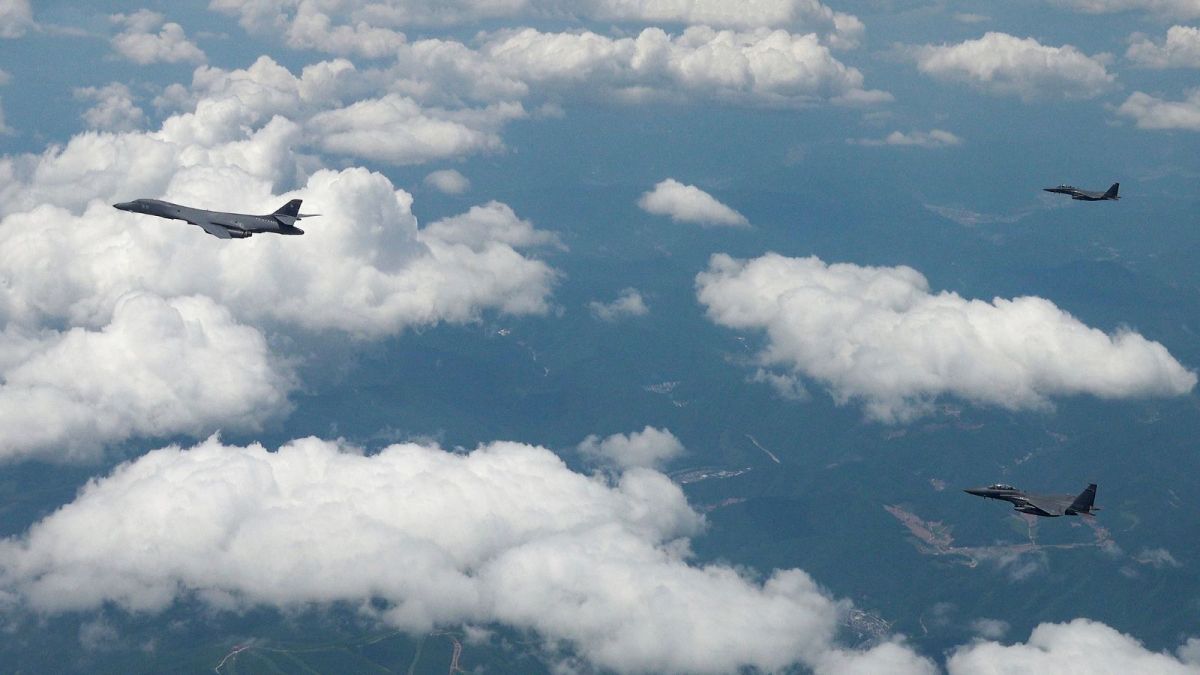 In this photo provided by the South Korea Defense Ministry, US Air Force B-1B bomber, left, and South Korean fighter jets F-15K fly over the Korean Peninsula during the joint aerial drills between South Korea and the United States, South Korea, Wednesday, June 5, 2024. (South Korea Defense Ministry via AP)