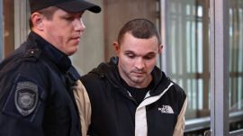 Gordon Black, a U.S. Army staff sergeant, who was detained in Russia on May 2 on suspicion of stealing from a woman he was in a relationship with, is escorted in a court during a hearing in Vladivostok, Russia, June 6, 2024.