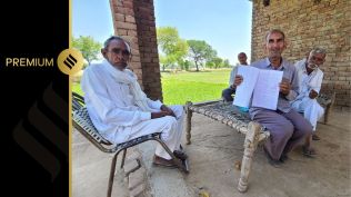 Gurmail Goyat holds documents related to his family’s 125-year-old land dispute in Haryana’s Majri Kalan village. (Express Photo by Jasbir Malhi)