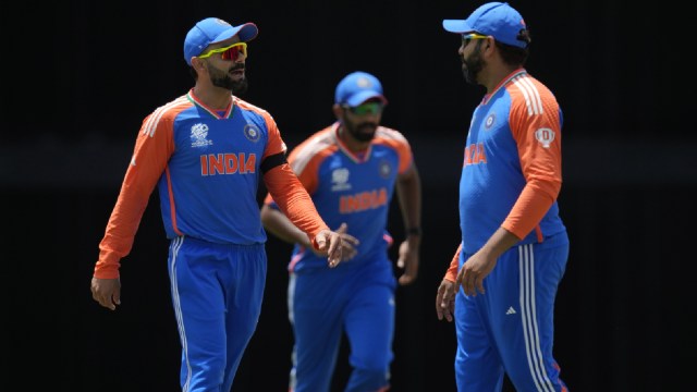 T20 World Cup 2024 Match Today: India's Virat Kohli, left, speaks to captain Rohit Sharma, right, during the ICC Men's T20 World Cup cricket match between Afghanistan and India at Kensington Oval in Bridgetown, Barbados. (AP)