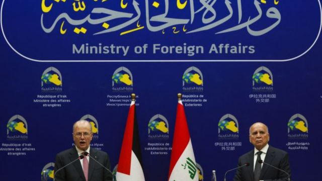 Palestinian Prime Minister Mohammad Mustafa speaks during a joint press conference with Iraqi Foreign Minister Fuad Hussein in Baghdad