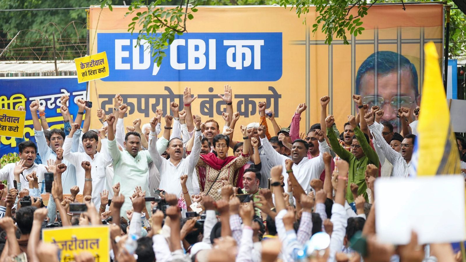 AAP leader Atishi with party workers stage a protest against the arrest of party convenor and Delhi CM Arvind Kejriwal, in New Delhi. (PTI PHOTO)