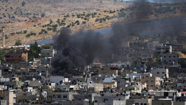 Smoke rises in the Palestinians Al Fara'a refugee camp in the occupied West Bank following an Israeli military raid, Monday, June 10, 2024. Israel's military killed a 15-year-old Palestinian in an overnight raid on Al Fara'a refugee camp in the occupied West Bank, according to Palestinian health officials. The military said Monday that it had begun what it described as a "counterterrorism" raid into the camp. It said soldiers killed one militant and injured two more with live fire and said the heavy exchanges of gunfire were ongoing. (AP/PTI)