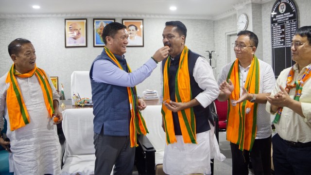 Arunachal Pradesh CM Pema Khandu feeding sweets to BJP's state-in-charge Ashok Singhal after the party's victory in the Assembly elections. (Photo: Pema Khandu/ X)