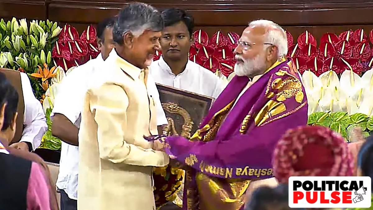 Narendra Modi being felicitated by TDP chief N Chandrababu Naidu during the NDA parliamentary party meeting on Friday. (PTI)