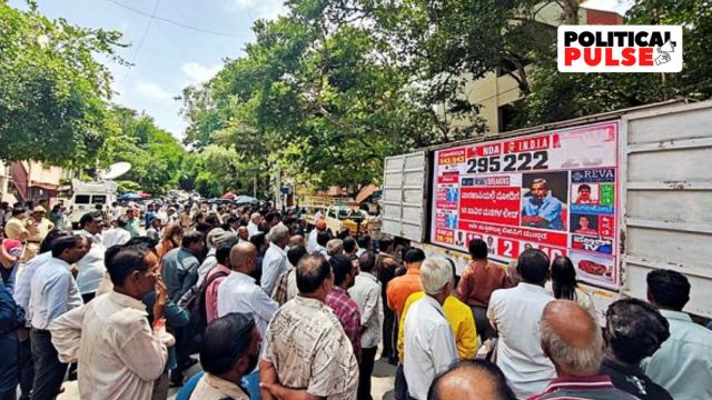 Supporters of the Bharatiya Janata Party (BJP) watch a screen showing initial poll results outside its party office in Bengaluru. (Reuters)
