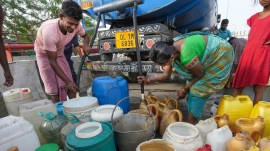 People collect drinking water from a tanker of Delhi Jal Board during a hot summer day, at a slum in Geeta Colony area, in East Delhi, Sunday, June 2, 2024. (PTI Photo)