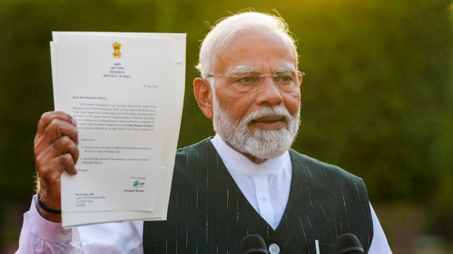 Prime Minister designate Narendra Modi shows to the media the letter of his appointment as Prime Minister by President Droupadi Murmu after a meeting with the latter to formally stake claim for government formation, at Rashtrapati Bhavan, in New Delhi, Friday, June 7, 2024. (PTI Photo)