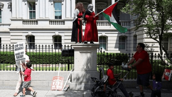 Protestors surround the White House grounds with a red banner symbolising President Biden's 'red line' about Israel going into Gaza's Rafah, during a pro-Palestinian protest, amid the Israel-Hamas conflict, in Washington. (Reuters photo)