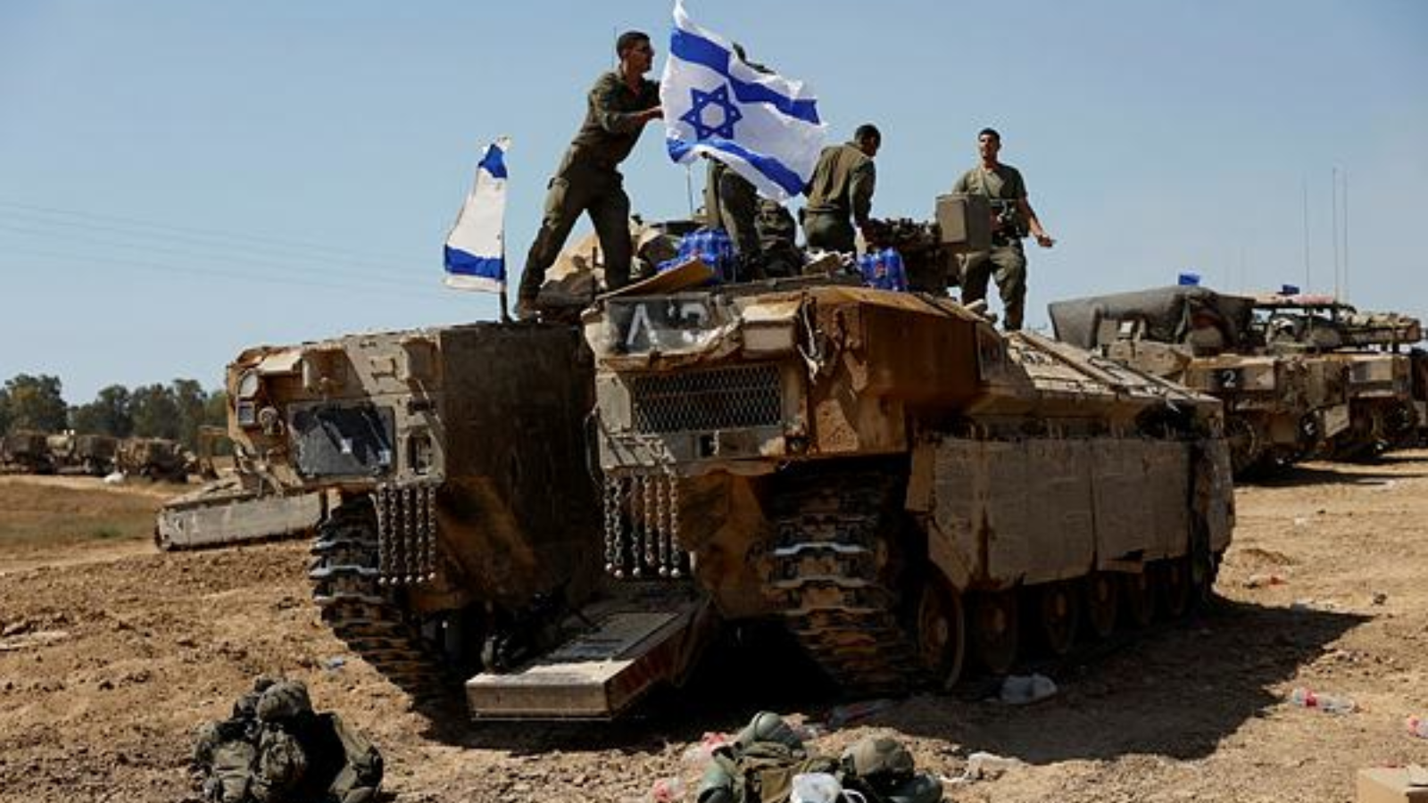 Soldiers stand on top of an Israeli armoured personnel carrier (APC), amid the ongoing conflict between Israel and Hamas, near the Israel-Gaza border, in Israel. (Photo: Reuters)