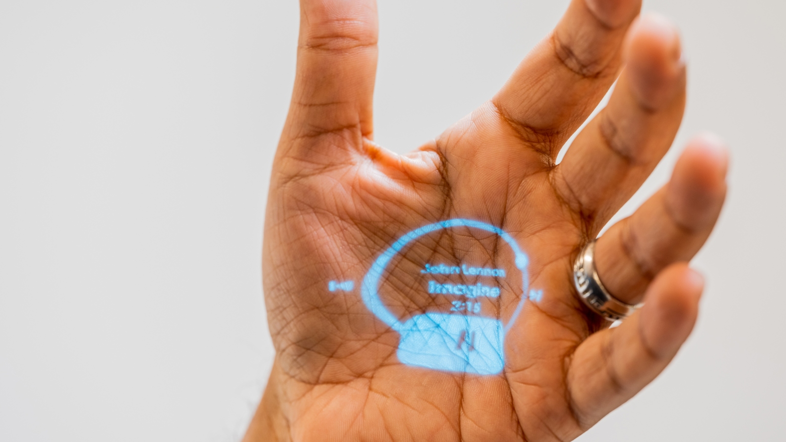 The Humane Ai Pin's interface is projected onto a palm, in San Francisco on Oct.  27, 2023. Humane, a company started by two former Apple employees, says its new artificial intelligence pin can stop all the scrolling.  Can it live up to the hype?