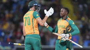 South Africa's Marco Jansen, left, and teammate Kagiso Rabada celebrate following the ICC Men's T20 World Cup cricket match between the West Indies and South Africa at Sir Vivian Richards Stadium in North Sound, Antigua and Barbuda, Sunday,