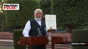 Prime Minister Narendra Modi shows to the media the letter of his appointment as Prime Minister by President Droupadi Murmu after a meeting with the latter to formally stake claim for government formation at Rashtrapati Bhavan, in New Delhi, Friday, June 7, 2024. Express photo by Renuka Puri