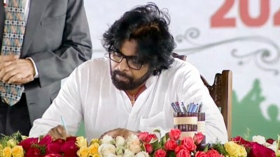 JanaSena chief Pawan Kalyan signs the register after taking oath as a Minister in the Andhra Pradesh government led by TDP supremo N Chandrababu Naidu. (PTI)