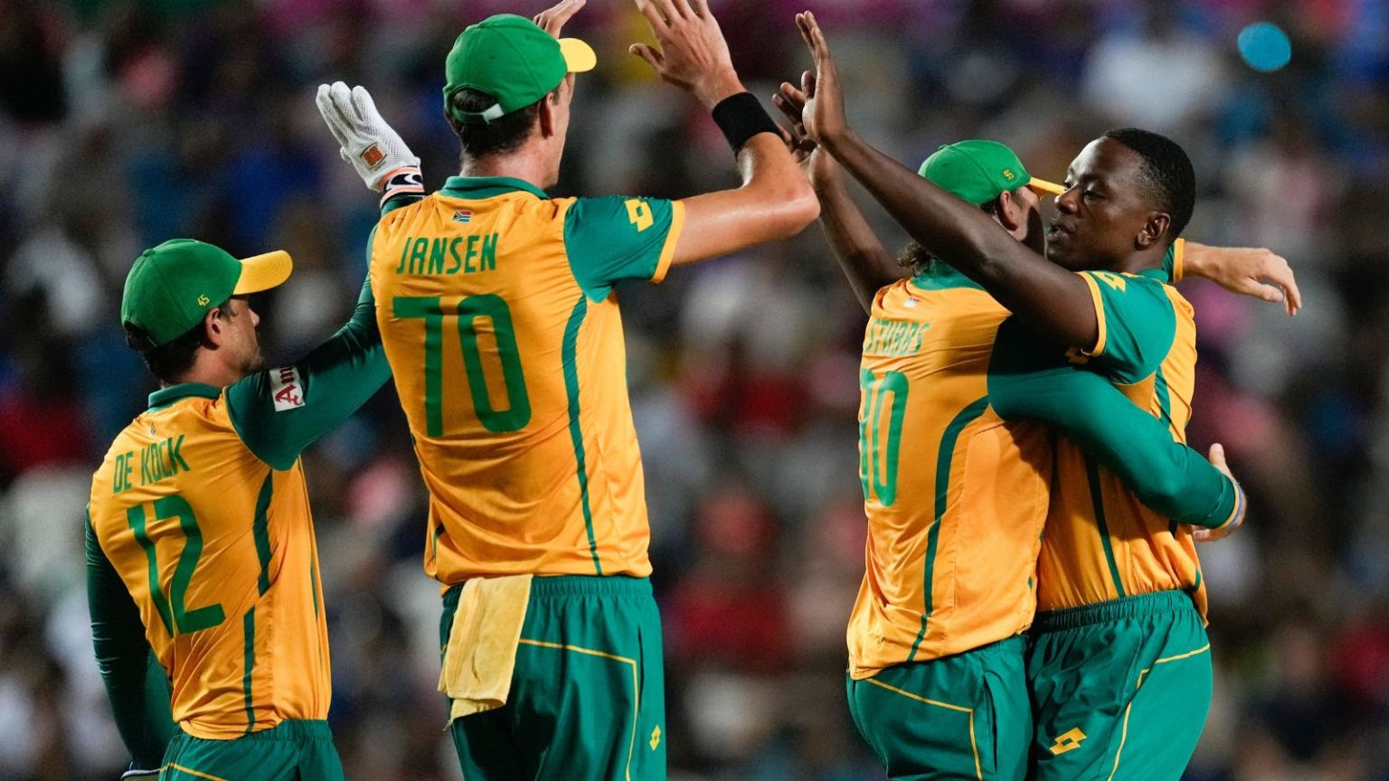 South Africa’s Kagiso Rabada, right, is congratulated by teammates after dismissing Afghanistan’s Ibrahim Zadran during the men’s T20 World Cup semifinal cricket match between Afghanistan and South Africa at the Brian Lara Cricket Academy in Tarouba, Trinidad and Tabago, 