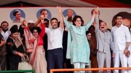 Congress MPs Rahul Gandhi, Kishori Lal Sharma and party leader Priyanka Gandhi Vadra during a public meeting, in Rae Bareli. (PTI)