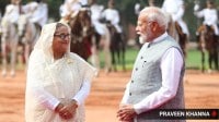 Prime Minister Narendra Modi greets Bangladesh PM Sheikh Hasina during the ceremonial reception at Rashtrapati Bhavan. (Express photo by Praveen Khanna)