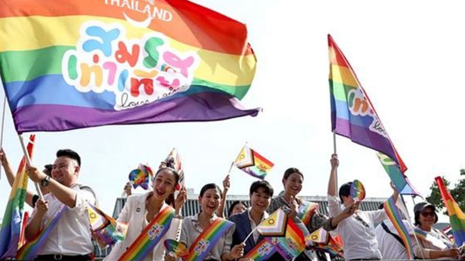 Members of the LGBTQ+ community hold flags that read "Marriage equality, love wins", as they celebrate the passing of the marriage equality bill in its second and third readings by the Senate, which will effectively make Thailand Asia's third territory to legalise same-sex unions. (Reuters photo)
