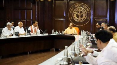 Uttar Pradesh Chief Minister Yogi Adityanath with his deputies Keshav Prasad Maurya and Brajesh Pathak during a state cabinet meeting, in Lucknow,