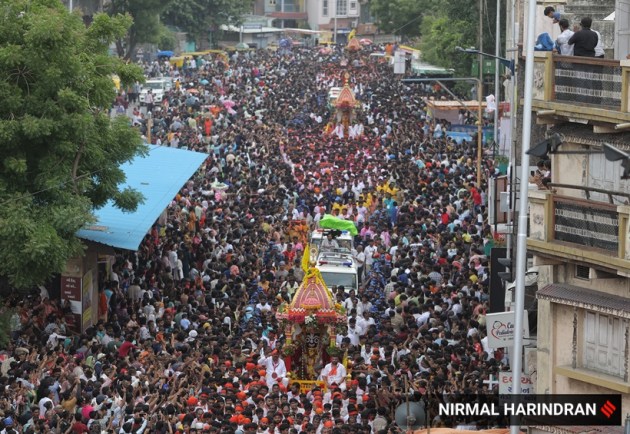 Ahmedabad, Gujarat, Lord Jagannath, Rath Yatra, devotees, security, chariots, Khalashi community, tradition, Ashadhi Beej, Hindu, temple, Jamalpur area, peaceful procession, Union Home Minister, Amit Shah, Gujarat Chief Minister, Bhupendra Patel, pahind vidhi, golden broom, medical emergencies, ambulances, GVK Emergency Management and Research Institute, 108 ambulance service, medical teams, government-run hospitals, CM Dashboard, Chief Minister's Office, security personnel, balloon-mounted cameras, traffic management, body-worn cameras, drones, surveillance cameras, CCTV cameras, decorated elephants, tableaux, akhadas (local gymnasiums), bhajan mandlis, T20 World Cup, renewable energy, Surat