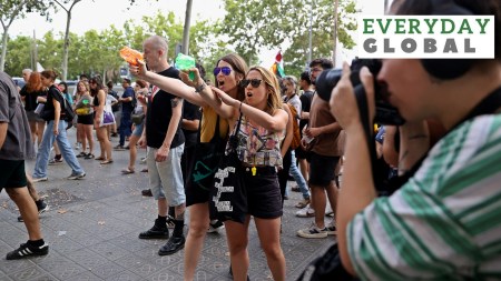Protesters shoot water from water guns at tourists during a protest against mass tourism in Barcelona, Spain, July 6, 2024.