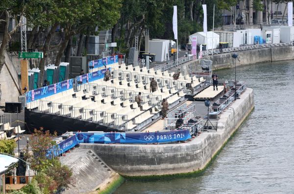 Members of the France military check the stand near the Seine river ahead of the Olympics. (REUTERS/Yves Herman)