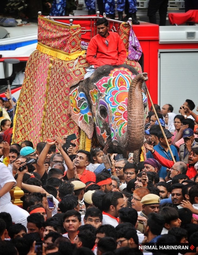 Ahmedabad, Gujarat, Lord Jagannath, Rath Yatra, devotees, security, chariots, Khalashi community, tradition, Ashadhi Beej, Hindu, temple, Jamalpur area, peaceful procession, Union Home Minister, Amit Shah, Gujarat Chief Minister, Bhupendra Patel, pahind vidhi, golden broom, medical emergencies, ambulances, GVK Emergency Management and Research Institute, 108 ambulance service, medical teams, government-run hospitals, CM Dashboard, Chief Minister's Office, security personnel, balloon-mounted cameras, traffic management, body-worn cameras, drones, surveillance cameras, CCTV cameras, decorated elephants, tableaux, akhadas (local gymnasiums), bhajan mandlis, T20 World Cup, renewable energy, Surat