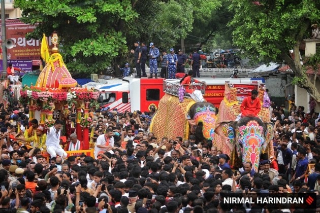 Ahmedabad, Gujarat, Lord Jagannath, Rath Yatra, devotees, security, chariots, Khalashi community, tradition, Ashadhi Beej, Hindu, temple, Jamalpur area, peaceful procession, Union Home Minister, Amit Shah, Gujarat Chief Minister, Bhupendra Patel, pahind vidhi, golden broom, medical emergencies, ambulances, GVK Emergency Management and Research Institute, 108 ambulance service, medical teams, government-run hospitals, CM Dashboard, Chief Minister's Office, security personnel, balloon-mounted cameras, traffic management, body-worn cameras, drones, surveillance cameras, CCTV cameras, decorated elephants, tableaux, akhadas (local gymnasiums), bhajan mandlis, T20 World Cup, renewable energy, Surat