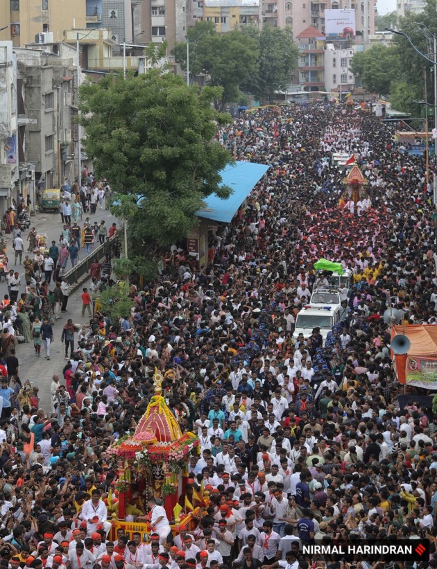 Ahmedabad, Gujarat, Lord Jagannath, Rath Yatra, devotees, security, chariots, Khalashi community, tradition, Ashadhi Beej, Hindu, temple, Jamalpur area, peaceful procession, Union Home Minister, Amit Shah, Gujarat Chief Minister, Bhupendra Patel, pahind vidhi, golden broom, medical emergencies, ambulances, GVK Emergency Management and Research Institute, 108 ambulance service, medical teams, government-run hospitals, CM Dashboard, Chief Minister's Office, security personnel, balloon-mounted cameras, traffic management, body-worn cameras, drones, surveillance cameras, CCTV cameras, decorated elephants, tableaux, akhadas (local gymnasiums), bhajan mandlis, T20 World Cup, renewable energy, Surat