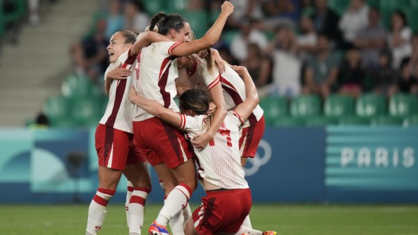 The Canadian team celebrates their team's 2-1 victory at the end of the Group A women's soccer match between Canada and France at Geoffroy-Guichard Stadium during the 2024 Summer Olympics. (AP)