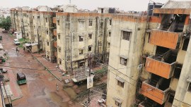 Government housing schemes, economically weaker sections, Gujarat eviction notices, liability period of structural damage, BSUP housing scheme, Gujarat collapsed, Vadodara Municipal Corporation, VMC contractor notice, Indian express news