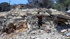 Lebanon's Hezbollah fires dozens of rockets at Israeli kibbutz