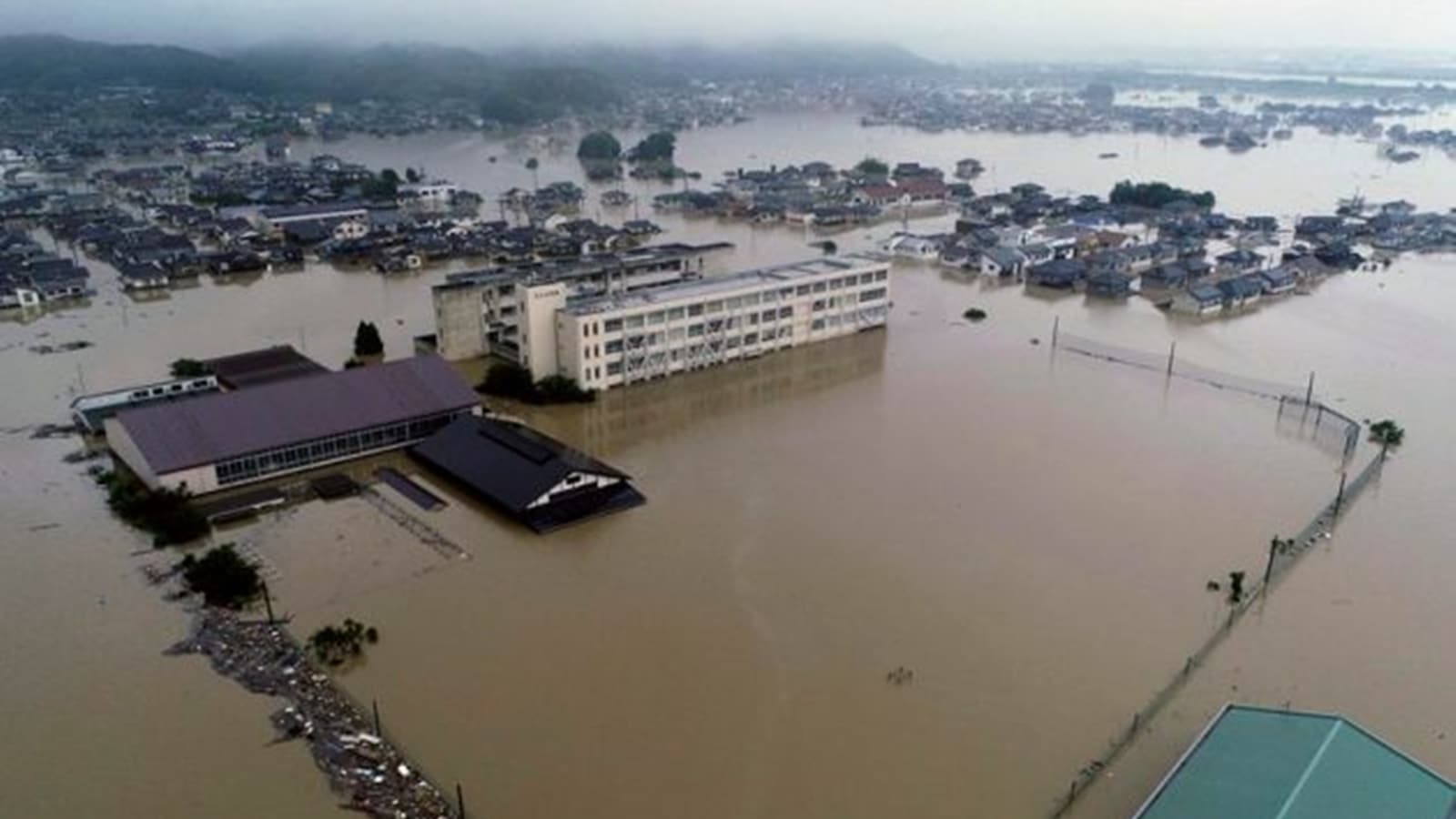 Heavy rain in northern Japan triggers floods and landslides, forcing ...