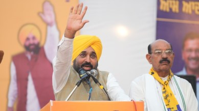 Chief Minister Bhagwant Mann with AAP candidate Mohinder Bhagat in Jalandhar on Thursday. X
