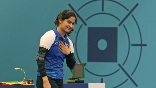 India's Manu Bhaker celebrates after winning the bronze medal in the 10m air pistol women's final round at the 2024 Summer Olympics,