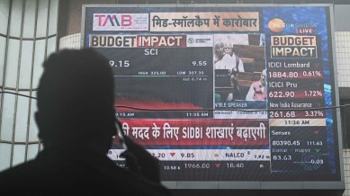 Stock Market Live Updates: A man watches as the stock market reacts to the announcements made in the Budget on Tuesday by Finance Minister Nirmala Sitharaman.