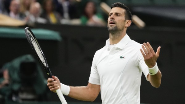 Novak Djokovic of Serbia reacts during his fourth round match against Hulger Rune of Denmark at the Wimbledon tennis championships in London