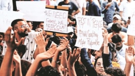 Students protest outside the IAS coaching centre in Old Rajinder Nagar, Sunday. (Express Photo by Amit Mehra)