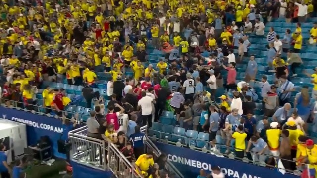 Uruguay players brawl with Colombian fans after their Copa America semi-final.