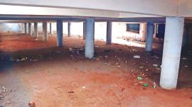 The parking lot in Sector 8-C is filled with filth, has eroded pillars, and does not have necessary illumination, painting a scary picture. 