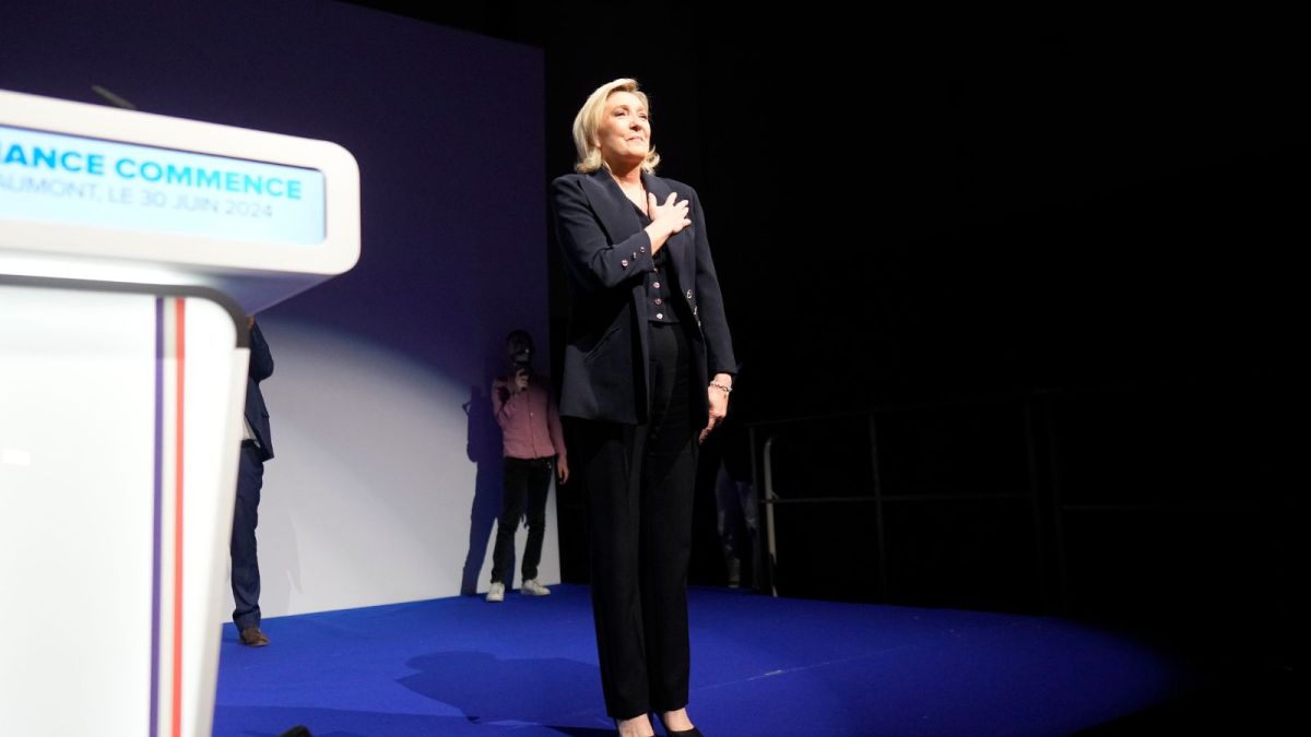 French far right leader Marine Le Pen gestures after delivering her speech after the release of projections based on the actual vote count in select constituencies , Sunday, June 30, 2024 in Henin-Beaumont, northern France. French voters propelled the far-right National Rally to a strong lead in first-round legislative elections Sunday and plunged the country into political uncertainty, according to polling projections. (AP Photo/Thibault Camus)