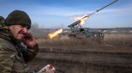 A Ukrainian officer with the 56th Separate Motorized Infantry Mariupol Brigade fires rockets from a pickup truck at Russian positions on the front line near Bakhmut in Ukraine's Donetsk region on March 5, 2024. Ukraine faces twin challenges of fighting Russia and the shifting political sands in the US. (AP Photo/Efrem Lukatsky) Ukraine