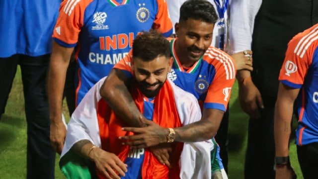 India's Hardik Pandya and Virat Kohli observe  arsenic  they instrumentality     a triumph  thigh  astir   the Wankhede stadium aft  winning the ICC men's T20 World Cup, successful  Mumbai