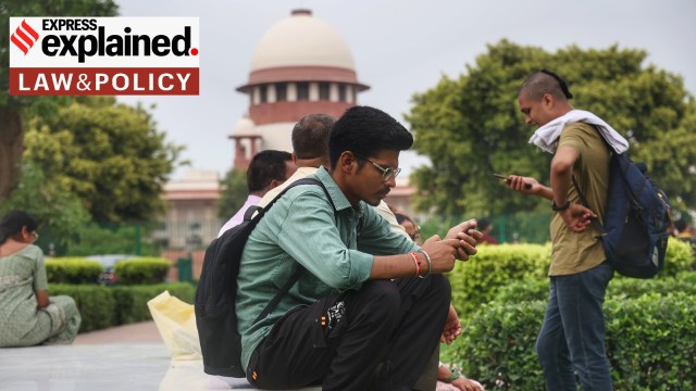 NEET candidates sit in the lawns of the Supreme Court premises in New Delhi, as hearings on cancelling this year's exam began on July 8.