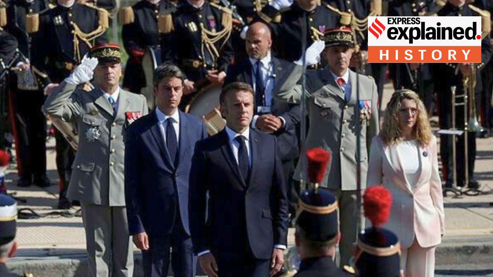 French President Emmanuel Macron and Prime Minister Gabriel Attal review troops during the annual Bastille Day military parade on the Avenue Foch in Paris, France, July 14, 2024.