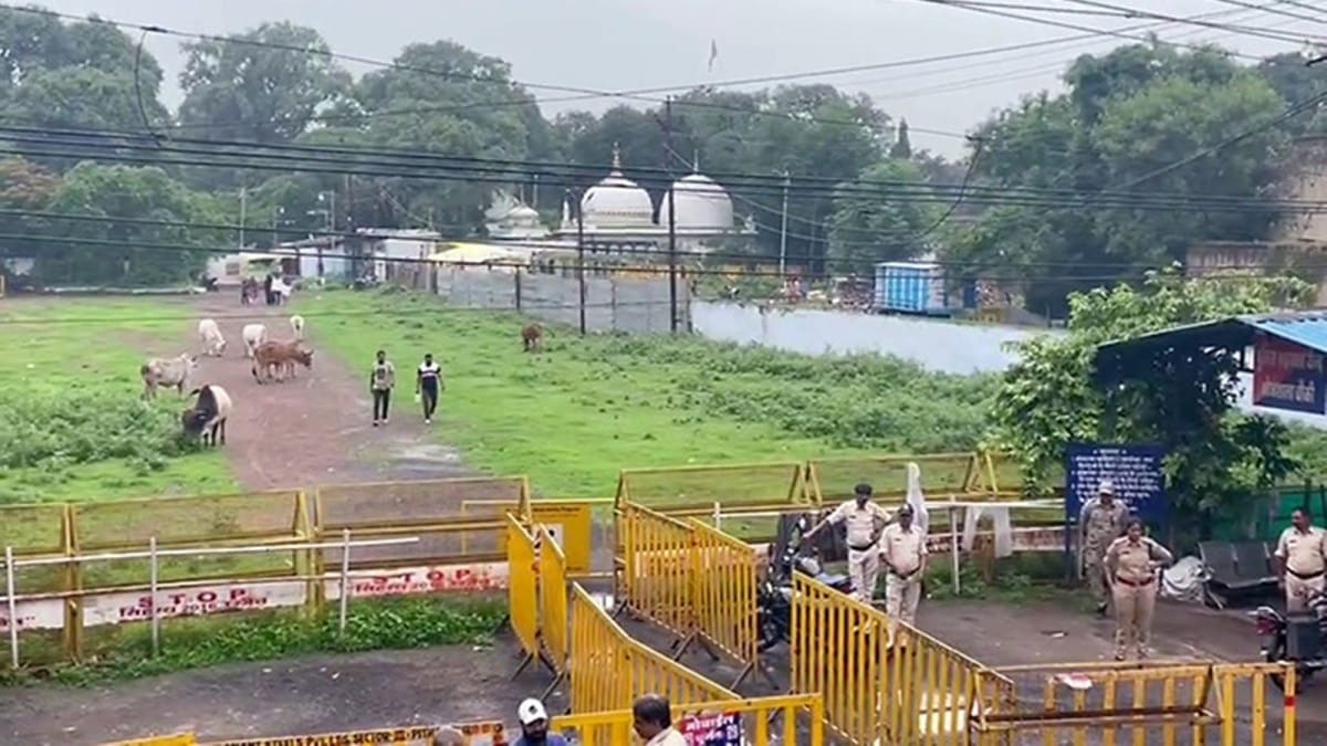 Police personnel stand guard outside the Bhojshala Temple as ASI submits survey report on Bhojshala complex before Madhya Pradesh High Court. (ANI)